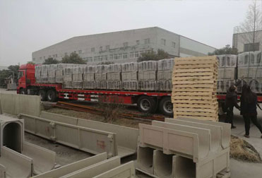 Polymer concrete drainage ditch loading and delivery site